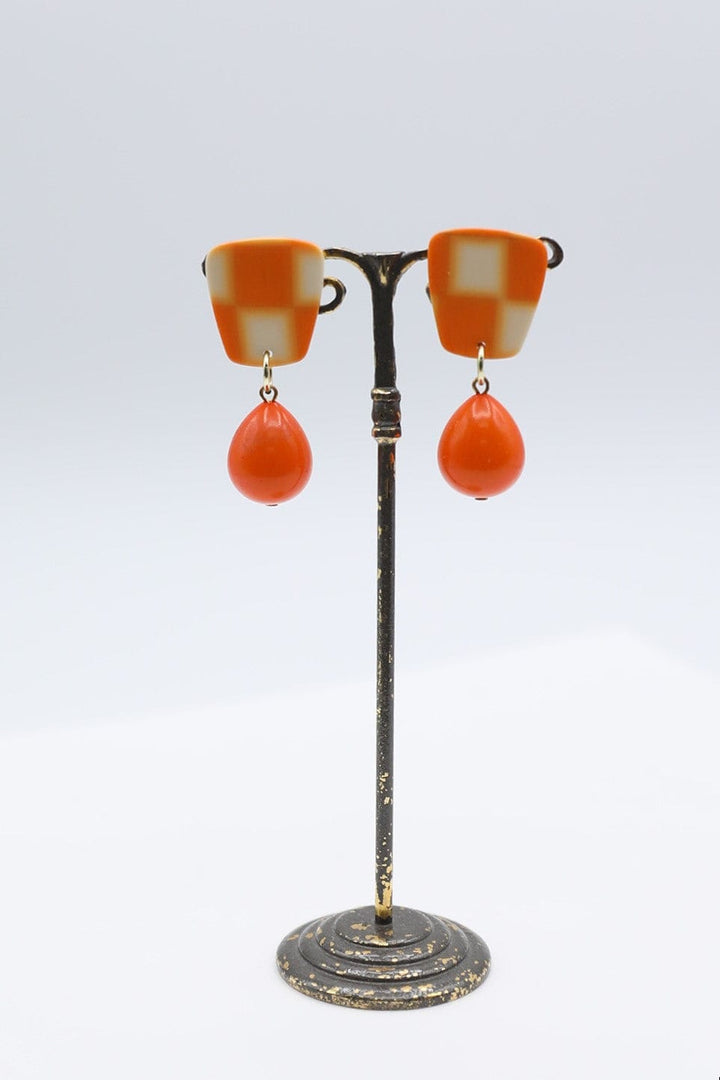 Checkerboard Earrings With Dangling Solid Orange Teardrop Accent Bead