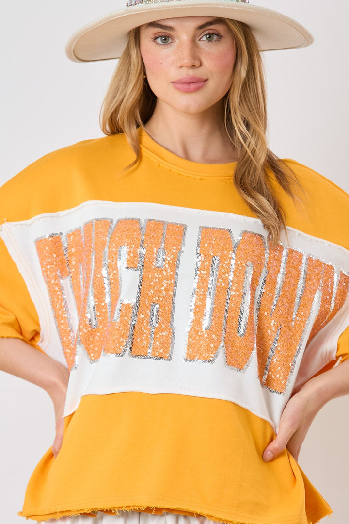 Fantastic Fawn Color Block Loose Fit Short Sleeve Top with Sequin Embroidered "Touch Down"