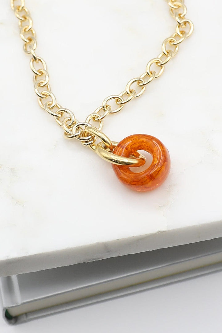 Necklace with Chunky Orange Resin Bead on Gold Chain