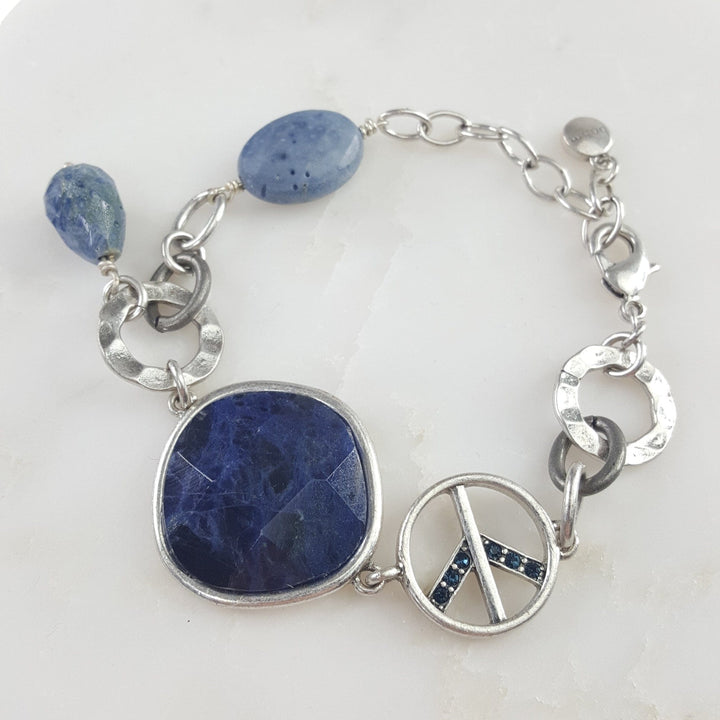 Silver Bracelet with Peace Sign and Large Blue Stone