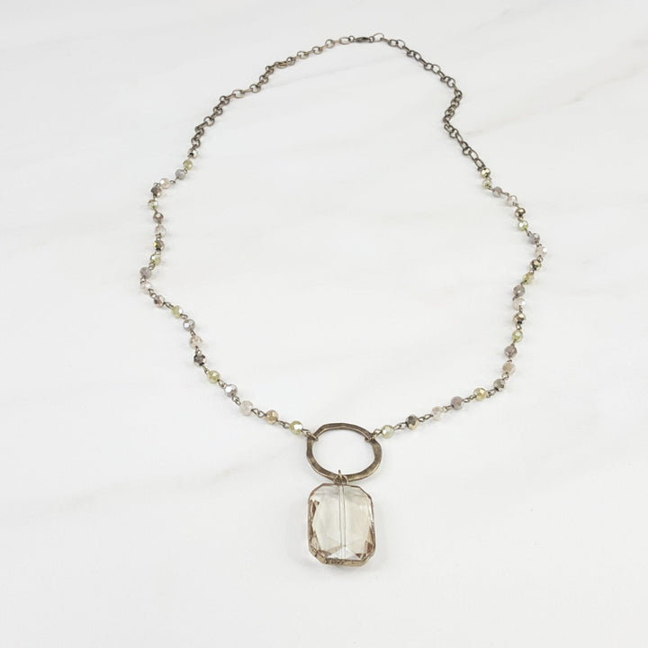 Women's Statement Necklace with Reflective Beads and Drop Feature with Large Connector Ring and Large Crystal Accent Pendant